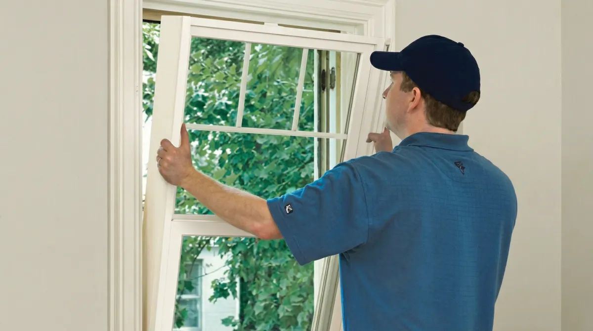 Professional contractors performing a residential window insulation and replacement service in Charleston, SC